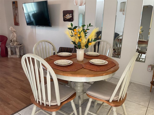 dining room featuring light tile patterned flooring