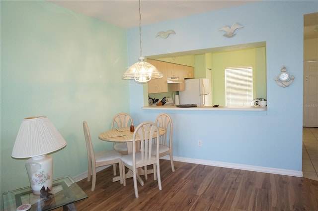 dining space featuring hardwood / wood-style floors