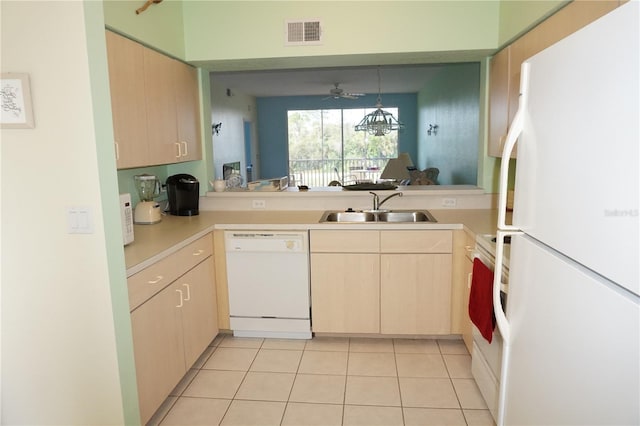 kitchen with decorative light fixtures, ceiling fan, white appliances, sink, and light tile floors