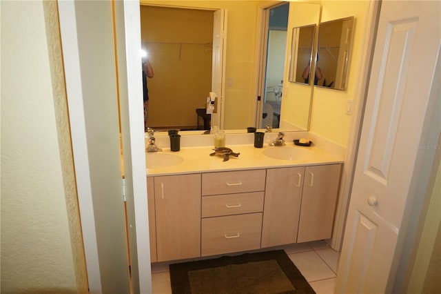 bathroom featuring dual vanity and tile flooring