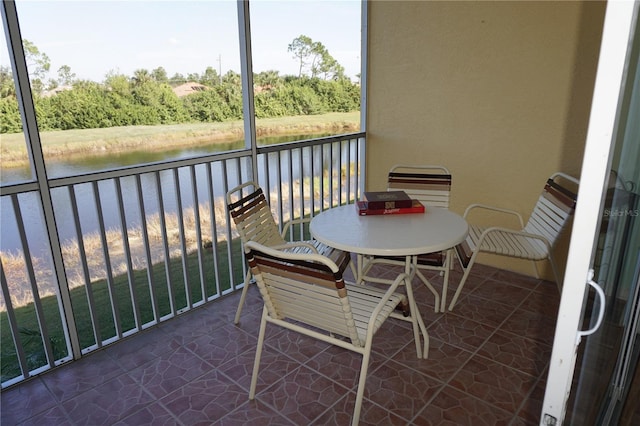 balcony featuring a water view