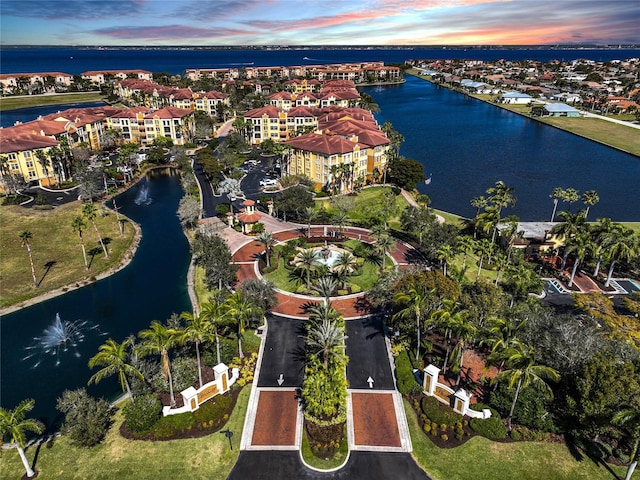 aerial view at dusk with a water view