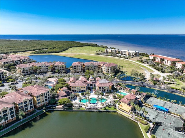 birds eye view of property with a water view