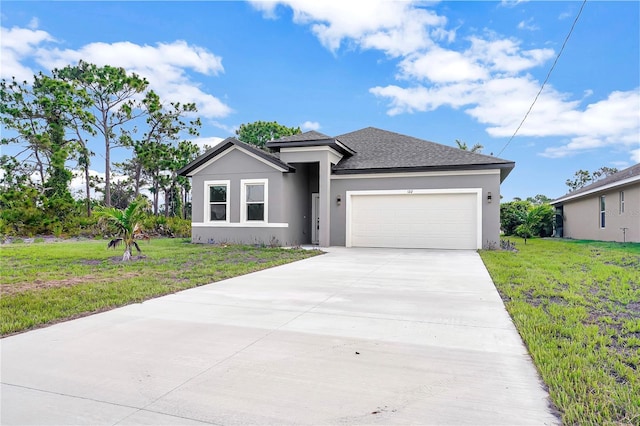 view of front of house with a front lawn and a garage