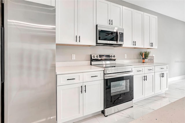 kitchen with white cabinets and stainless steel appliances