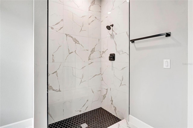 bathroom with tiled shower