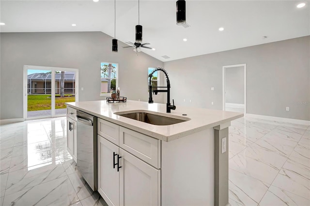 kitchen with dishwasher, white cabinetry, sink, a kitchen island with sink, and vaulted ceiling