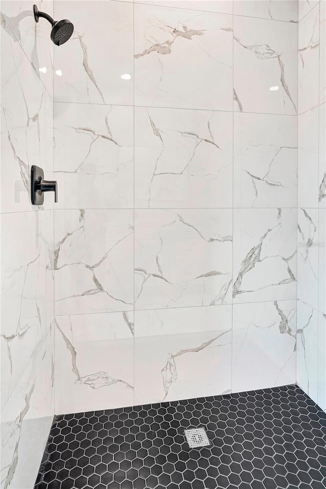 bathroom with tiled shower