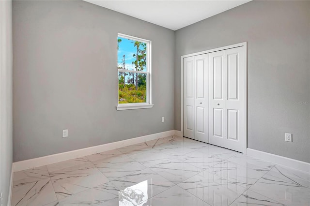 unfurnished bedroom with a closet