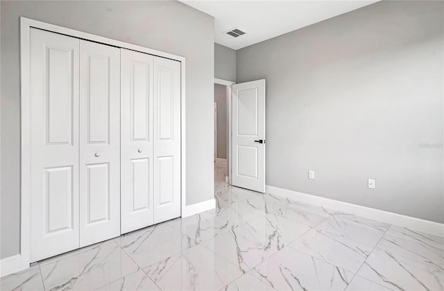 unfurnished bedroom featuring a closet