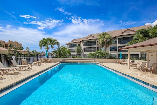 view of swimming pool with a patio