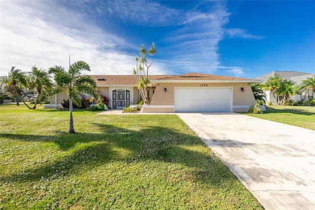 single story home with a garage and a front lawn