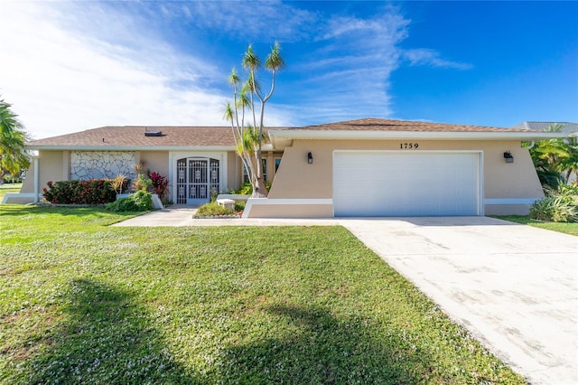 ranch-style home featuring a garage and a front yard