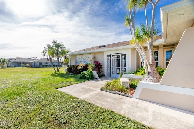 view of front of property with a front lawn