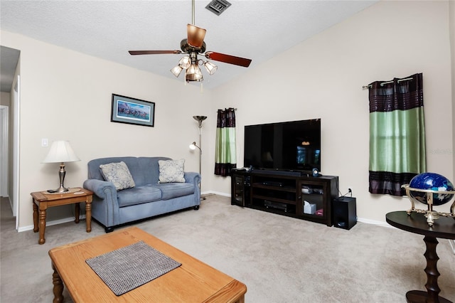 carpeted living room featuring lofted ceiling, a textured ceiling, and ceiling fan