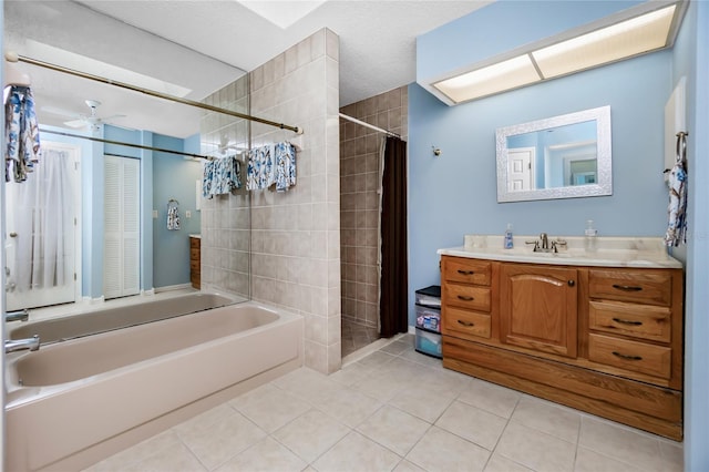 bathroom featuring ceiling fan, vanity, and tile patterned floors