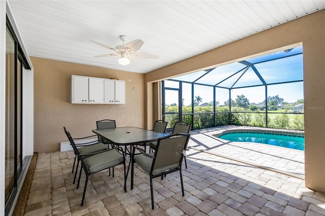 interior space with glass enclosure and ceiling fan