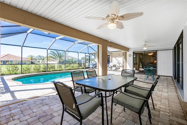 exterior space with a lanai and ceiling fan