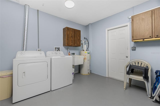 laundry room featuring separate washer and dryer, cabinets, and water heater