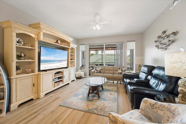 living room with light hardwood / wood-style flooring and ceiling fan