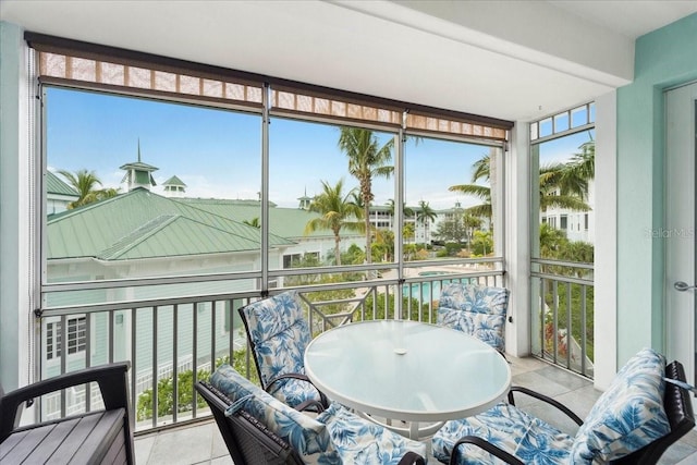 sunroom / solarium featuring a healthy amount of sunlight