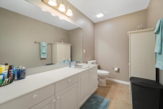 bathroom with tile patterned floors, vanity, and toilet