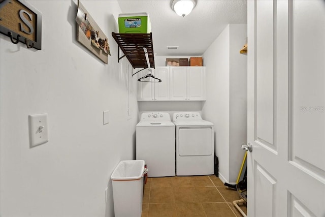 5127 Melbourne St Unit F-204, Port Charlotte, FL 33980 - laundry room with cabinet space, independent washer and dryer, and tile patterned floors
