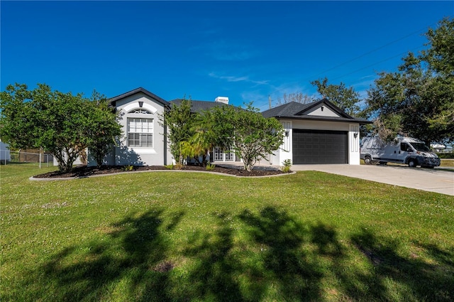 single story home with a garage and a front yard