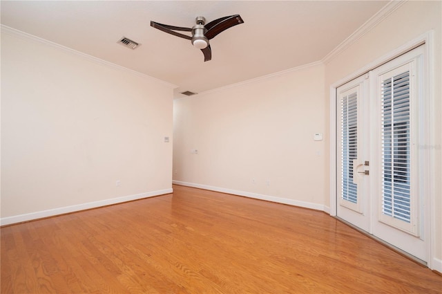 empty room with ceiling fan, light wood-type flooring, french doors, and ornamental molding