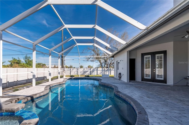 view of pool featuring a lanai, french doors, and a patio