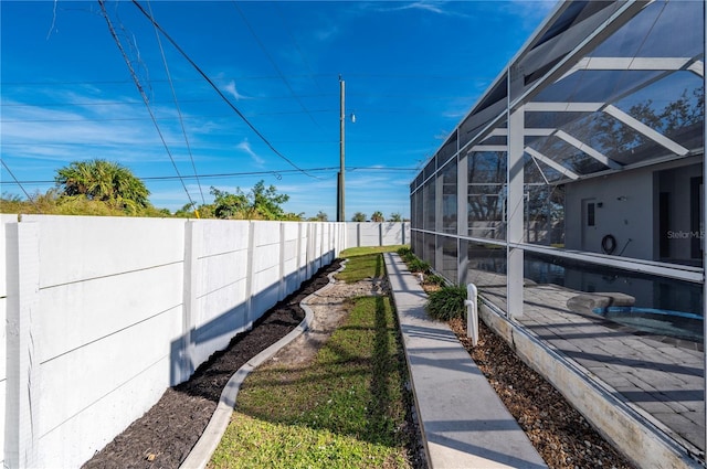 view of yard featuring a lanai and a patio