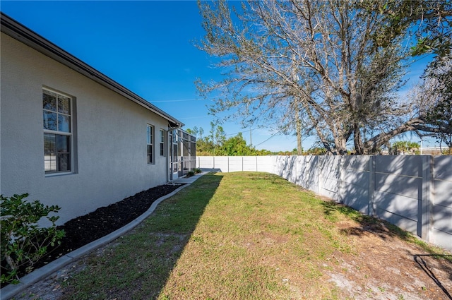 view of yard with a lanai