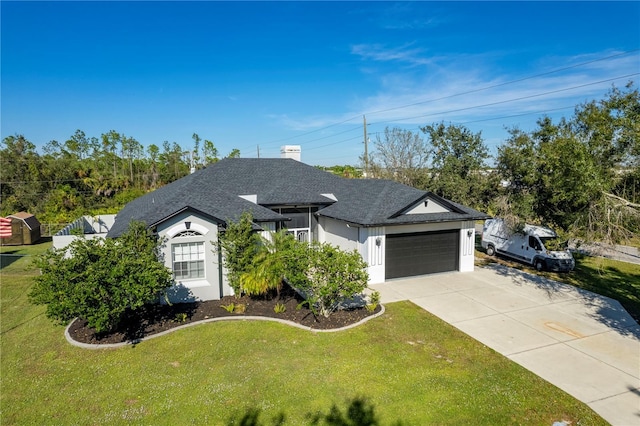 view of front facade featuring a garage and a front lawn