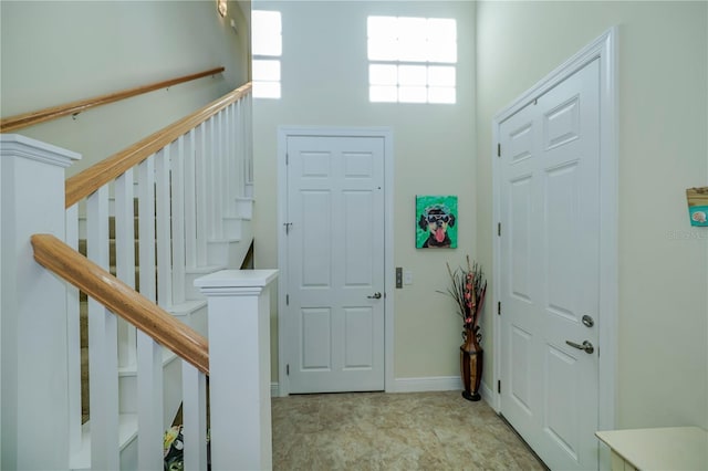 entryway with a high ceiling