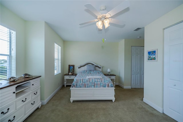 carpeted bedroom featuring ceiling fan