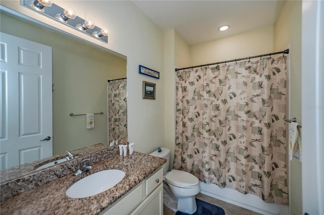 full bathroom with tile patterned flooring, shower / bath combo, vanity, and toilet