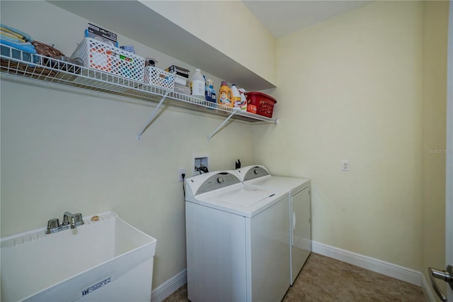 washroom featuring sink and independent washer and dryer