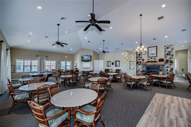 dining area featuring lofted ceiling, dark wood-type flooring, and ceiling fan