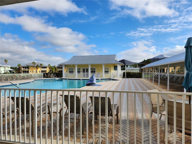 view of swimming pool with a patio area