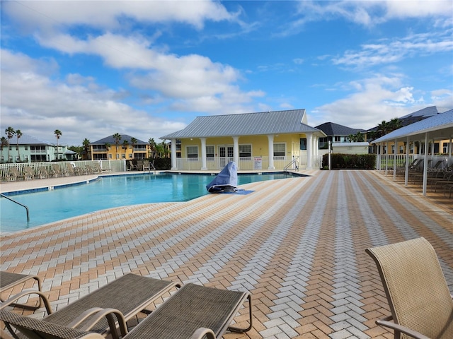 view of swimming pool with a patio area