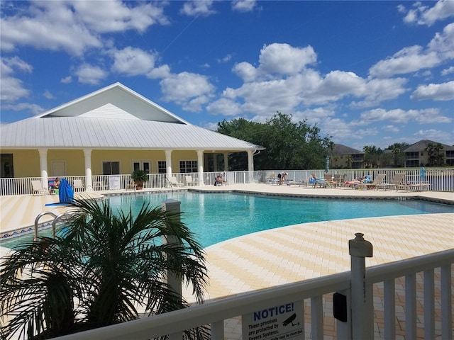 view of swimming pool featuring a patio area