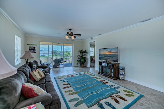 tiled living room with ceiling fan and ornamental molding