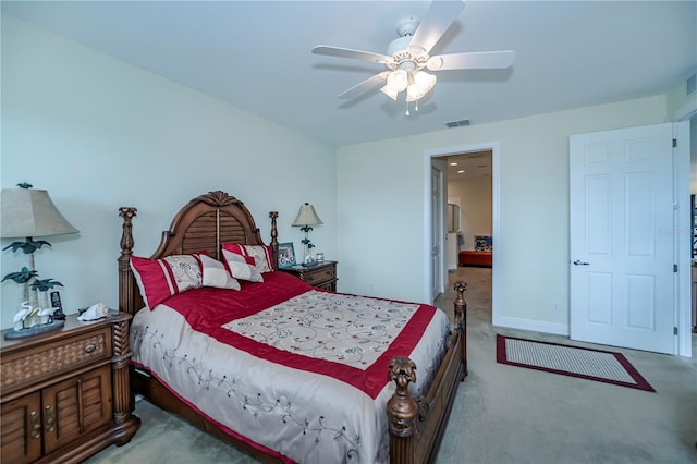 bedroom featuring carpet flooring, visible vents, baseboards, and ceiling fan