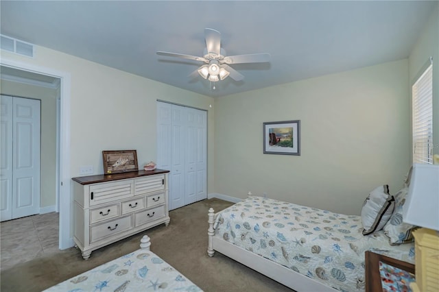 bedroom featuring visible vents, a ceiling fan, a closet, and carpet flooring