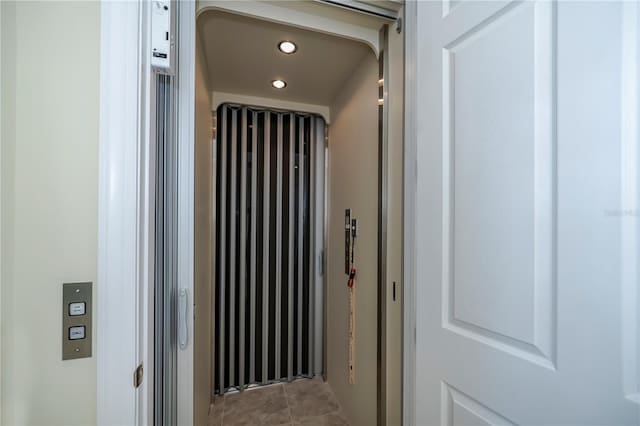 room details with elevator and recessed lighting