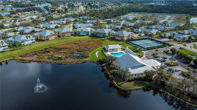 birds eye view of property featuring a residential view and a water view