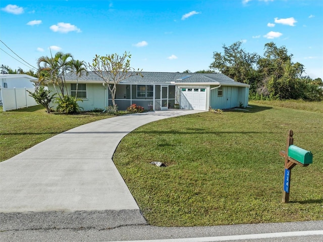 ranch-style house with a garage and a front yard