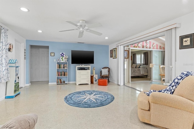 living room featuring ceiling fan