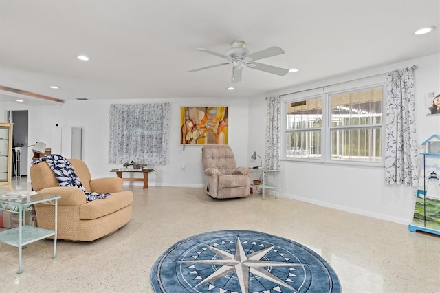 living area featuring ceiling fan