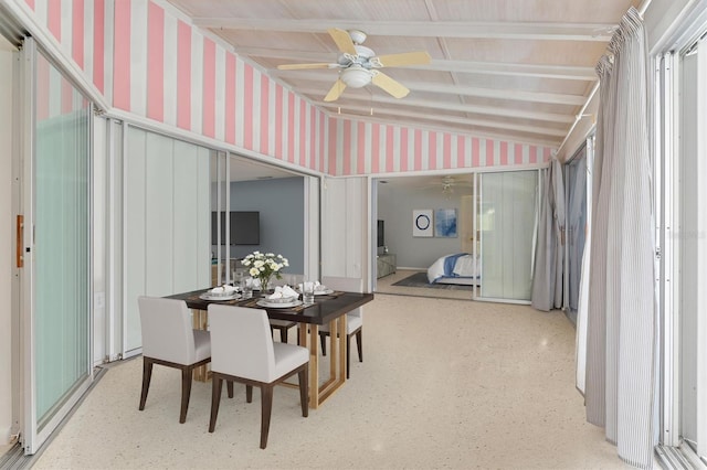 dining area featuring vaulted ceiling with beams and ceiling fan